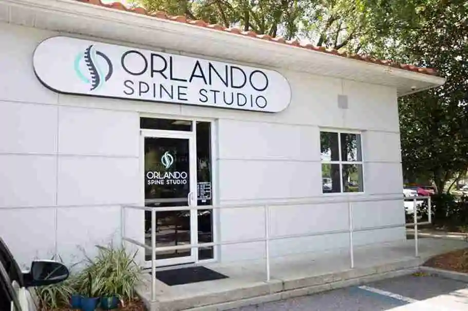 Orlando Spine Studio storefront with white exterior and glass entrance doors